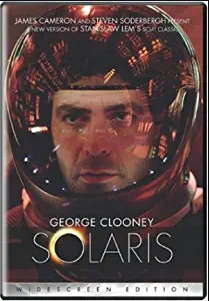 George Clooney pictured in a space suit and helmet
