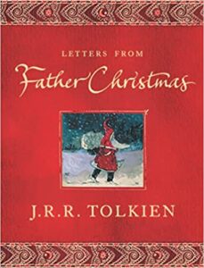 cover of paperback edition Letters from Father Christmas by JRR Tolkien, a red cover with insert showing Father Christmas trudging through the snow.